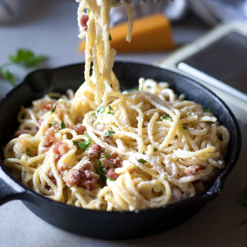 This Eggless Spaghetti Carbonara is Low FODMAP and lactose-free with a dairy-free option. It's flavorful, comforting and super creamy eggless alternative to the traditional carbonara spaghetti recipe.