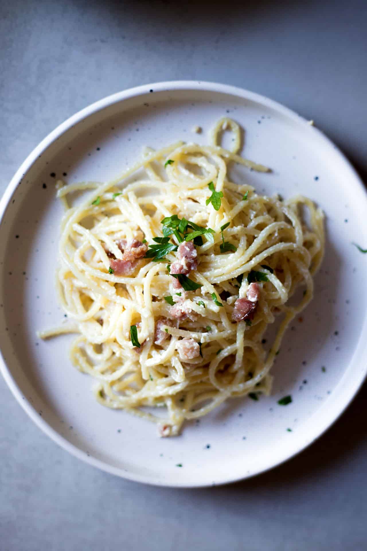 This Eggless Spaghetti Carbonara is Low FODMAP and lactose-free with a dairy-free option. It's a flavorful, comforting and super creamy eggless alternative to the traditional carbonara spaghetti recipe.