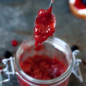 a teaspoon with strawberry spread