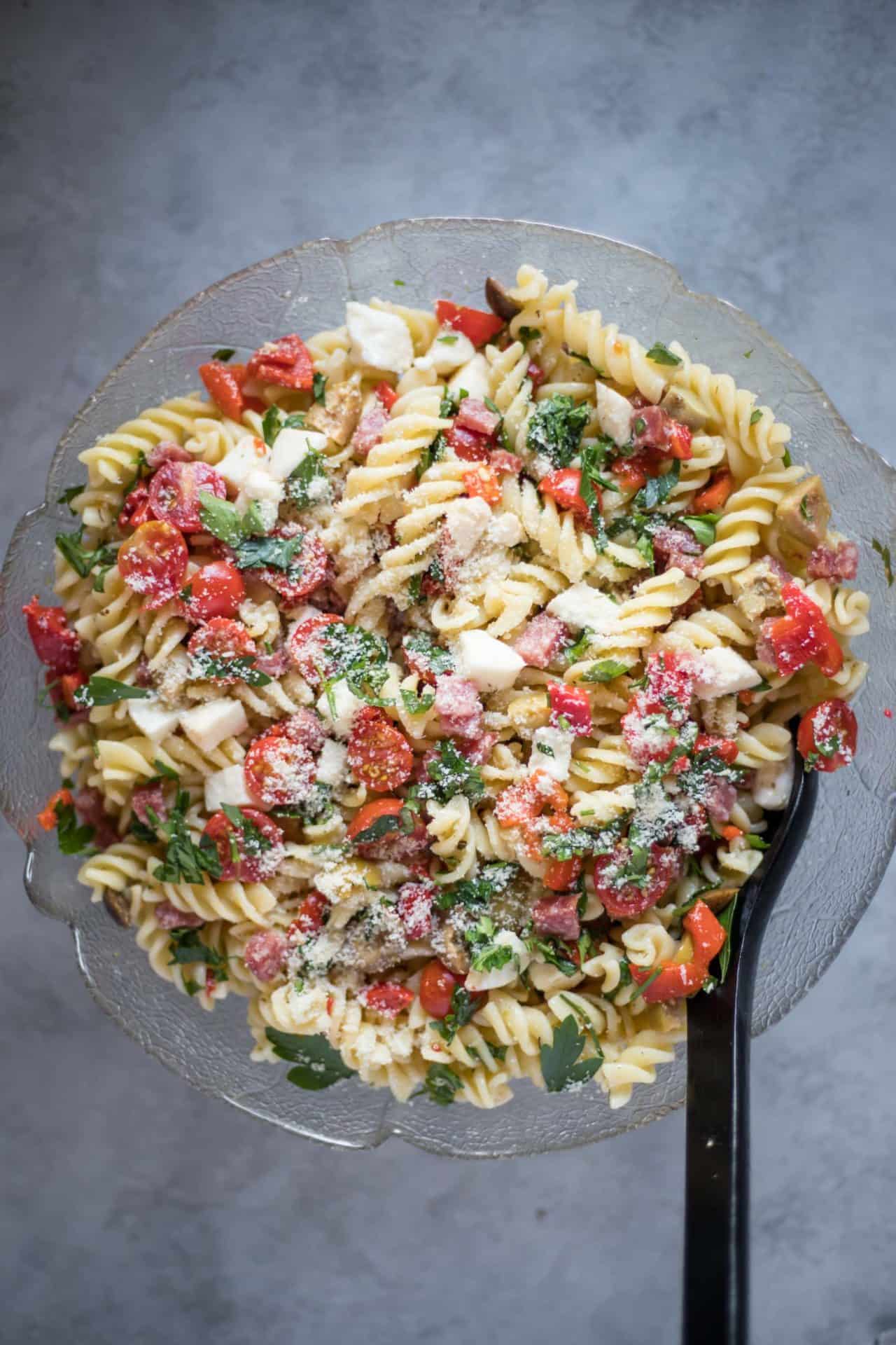 Simple and Refreshing Low FODMAP Italian Pasta Salad, with an option to make it vegan. It's super easy to make, healthy and IBS Friendly.