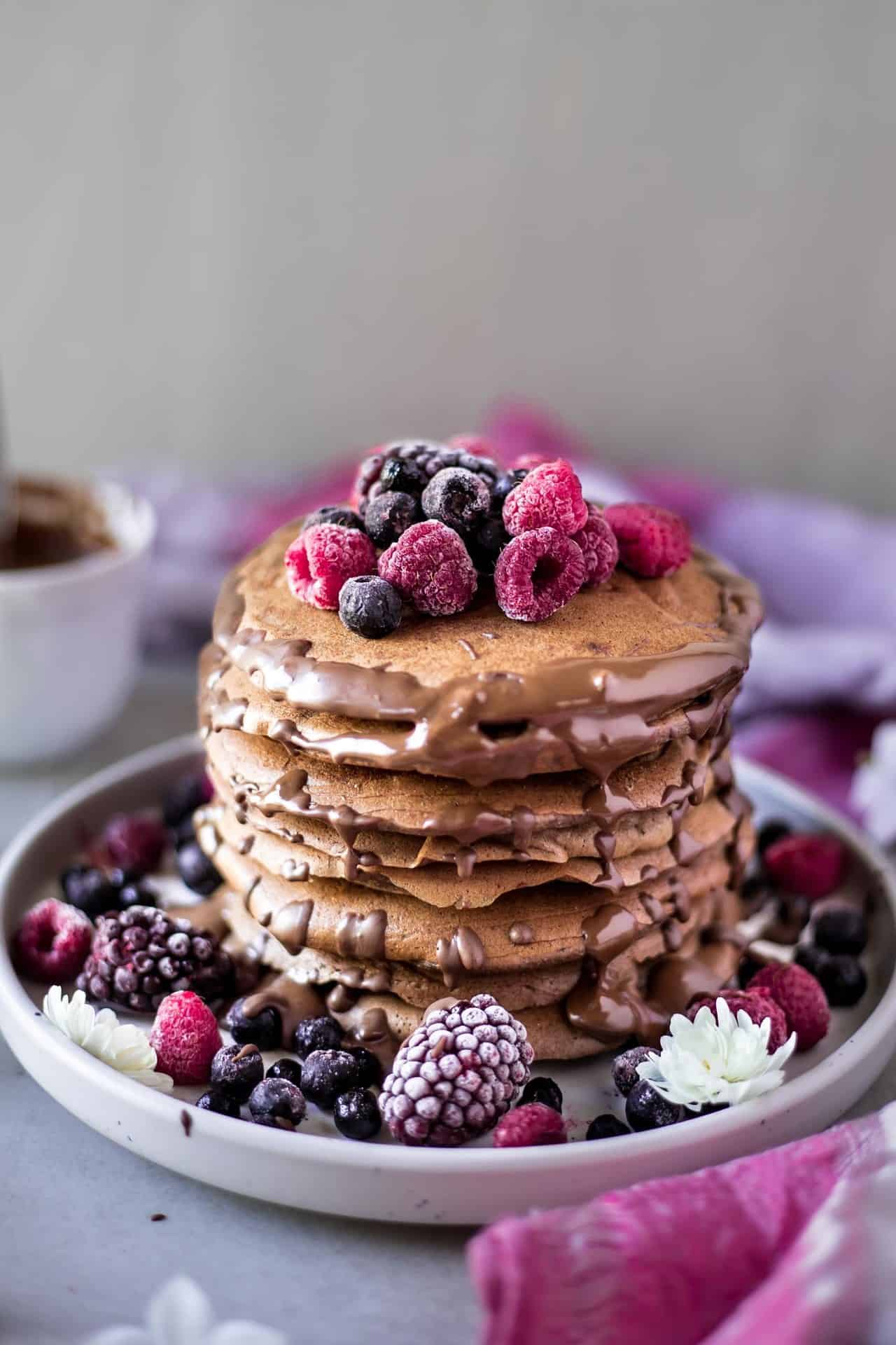 These gluten free chocolate banana pancakes are vegan and low FODMAP. They are so fluffy, flavorful, chocolaty and super delicious.