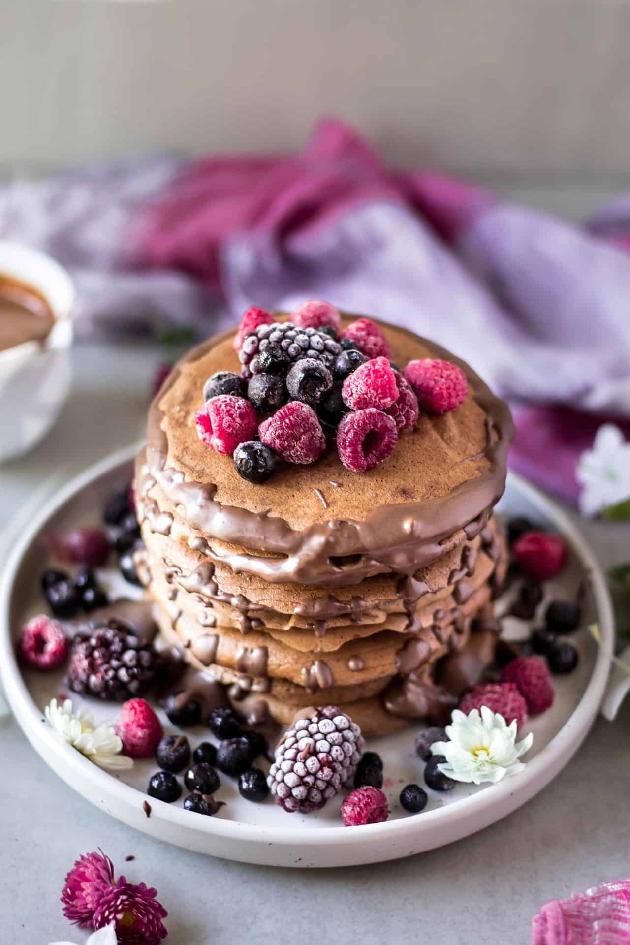 These gluten free chocolate banana pancakes are vegan and low FODMAP. They are so fluffy, flavorful, chocolaty and super delicious.