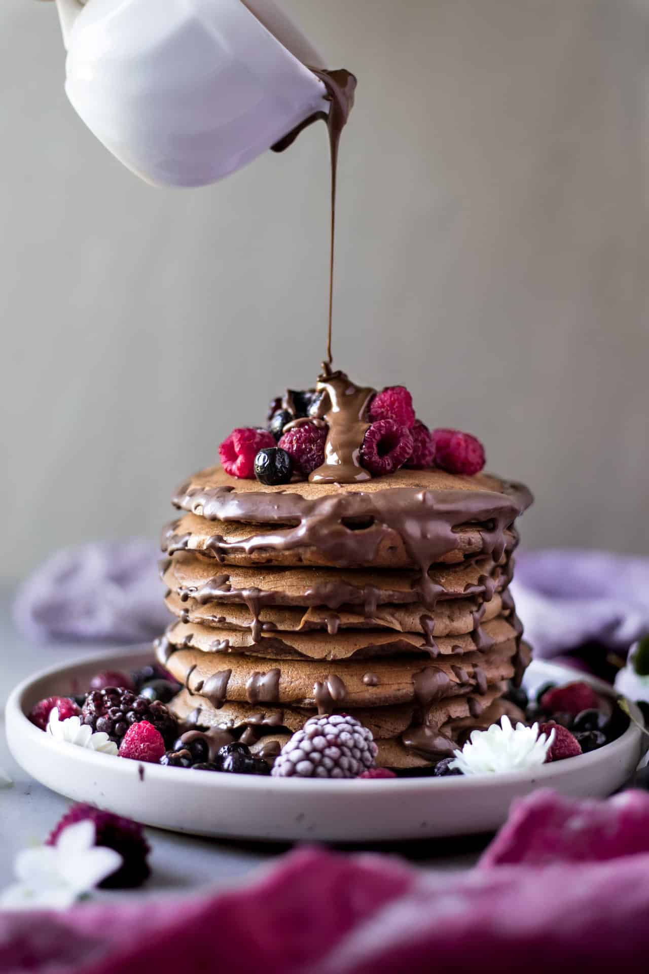 These gluten free chocolate banana pancakes are vegan and low FODMAP. They are so fluffy, flavorful, chocolaty and super delicious.