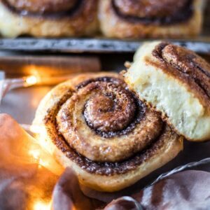 a close up of two cinnamon rolls
