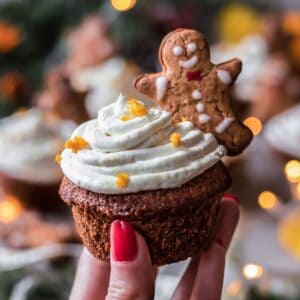 gingerbread cupcake decorated with frosting and a gingerbread cookie