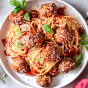 Meatballs served with spaghetti and tomato sauce