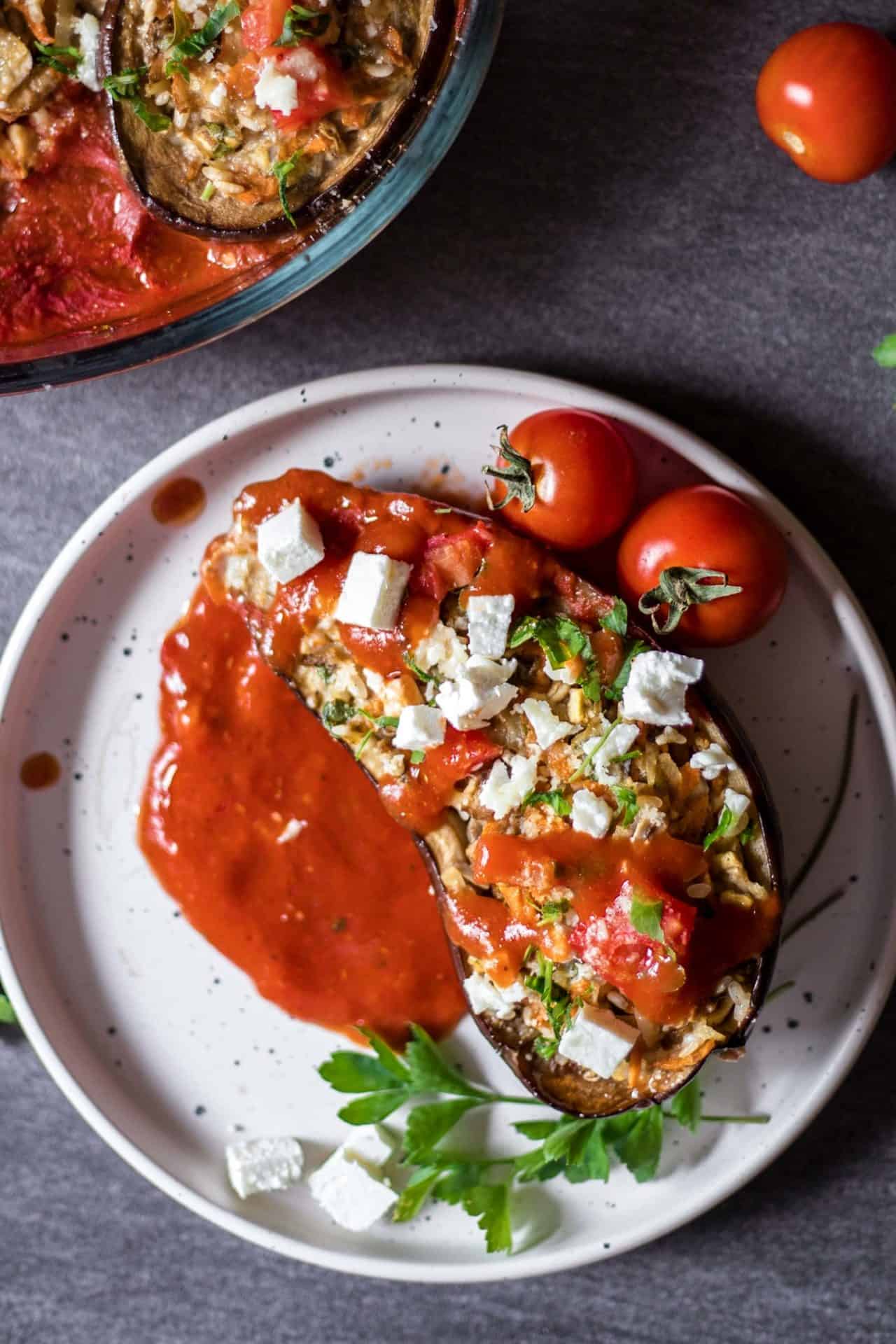 Simple and healthy Low FODMAP Veggie Stuffed Eggplant. Option to make it completely vegan. A flavorful, comforting and super delicious dish.