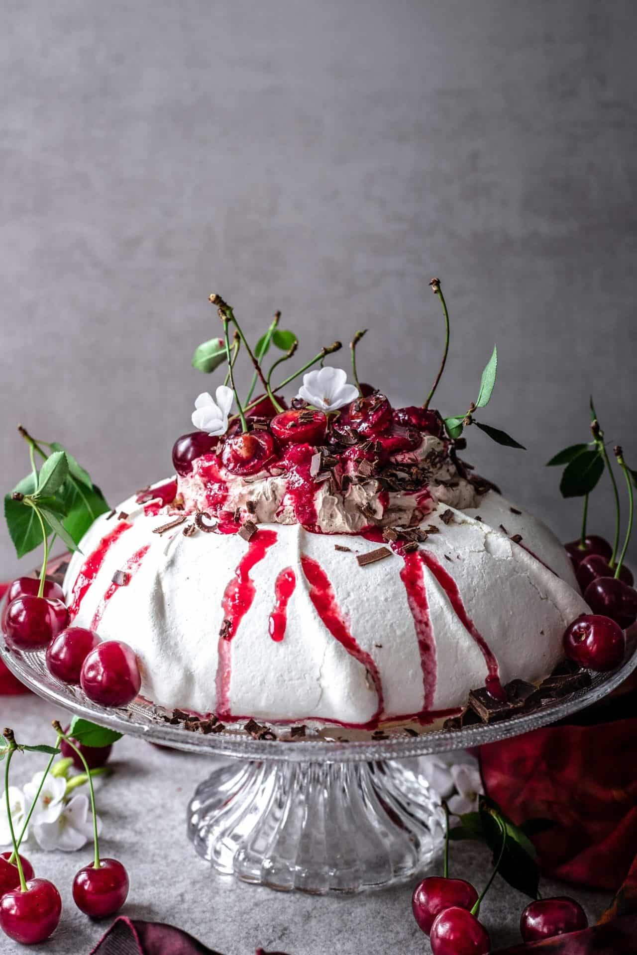 This Black Forest Pavlova is crunchy on the top, soft and marshmallowy in the middle, perfectly sweetened, chocolaty, cherry-infused and so delicious.