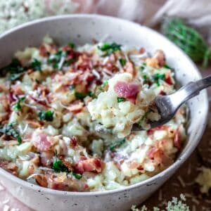 A bite of creamy carbonara risotto