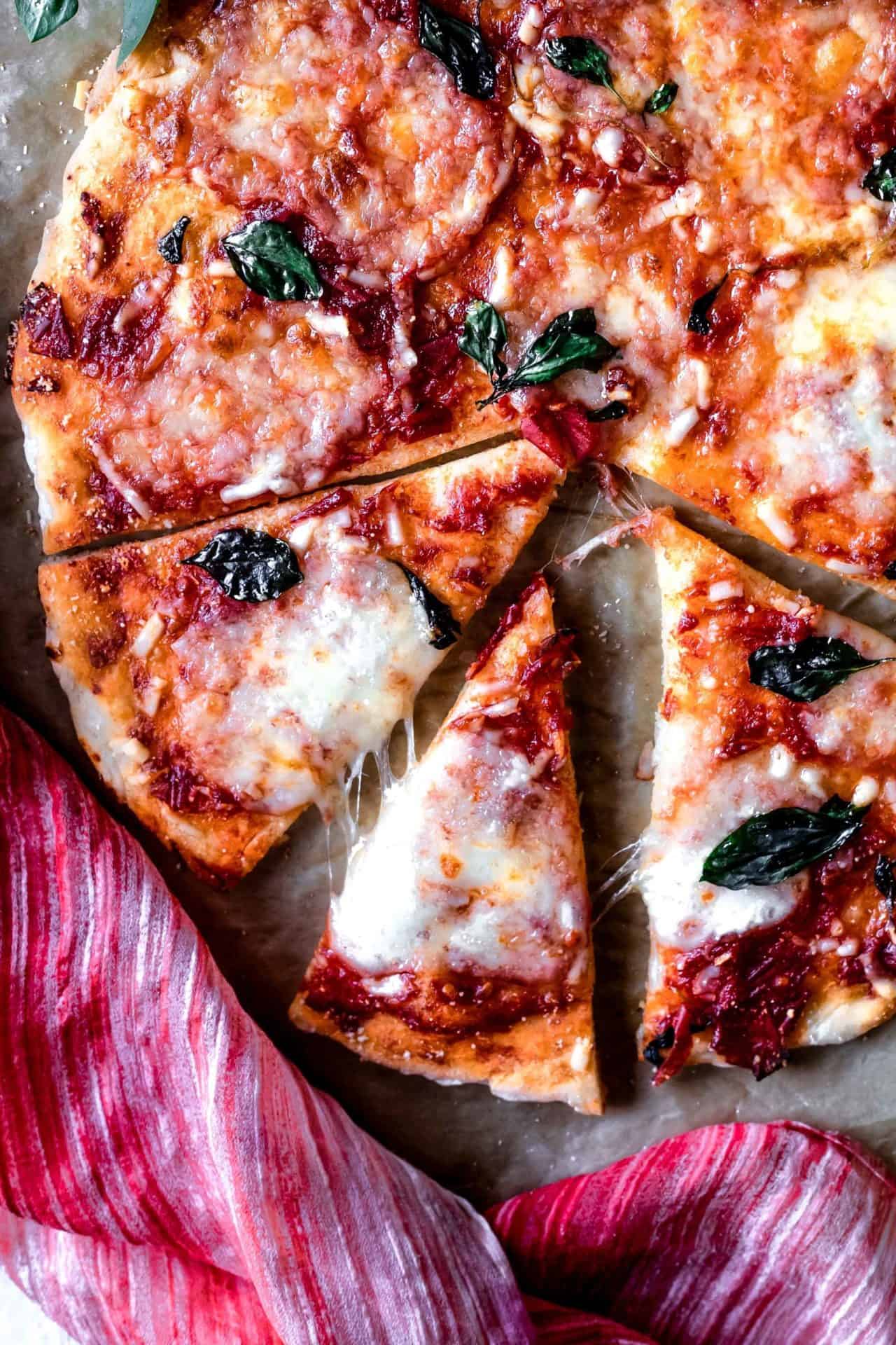 This Gluten-Free Pizza Crust is thin, perfectly crisp on the edges and tender in the center, requires only 7 ingredients and it is so delicious!