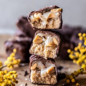 A stack of three vegan snickers bars