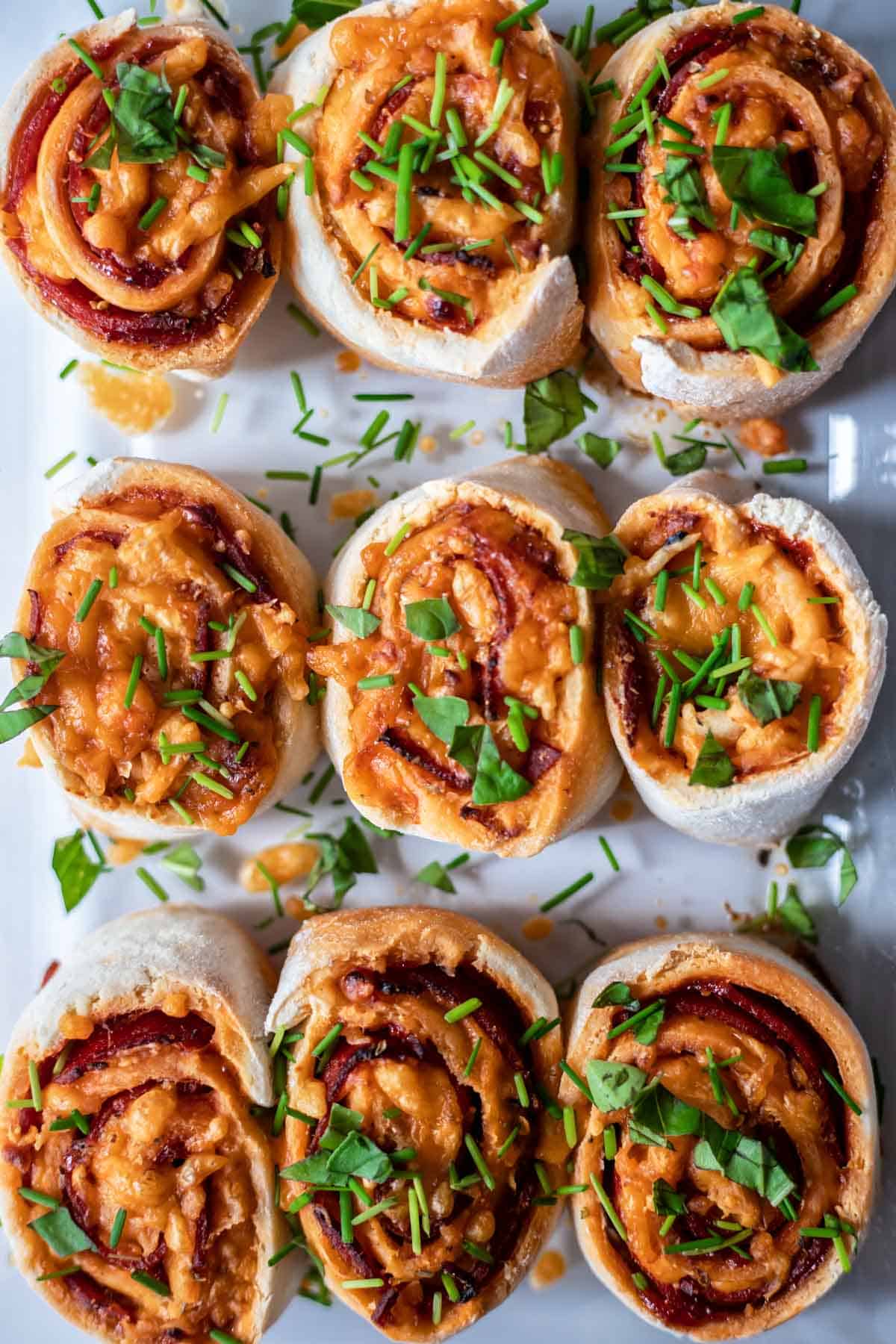 A close up of freshly baked pizza rolls.