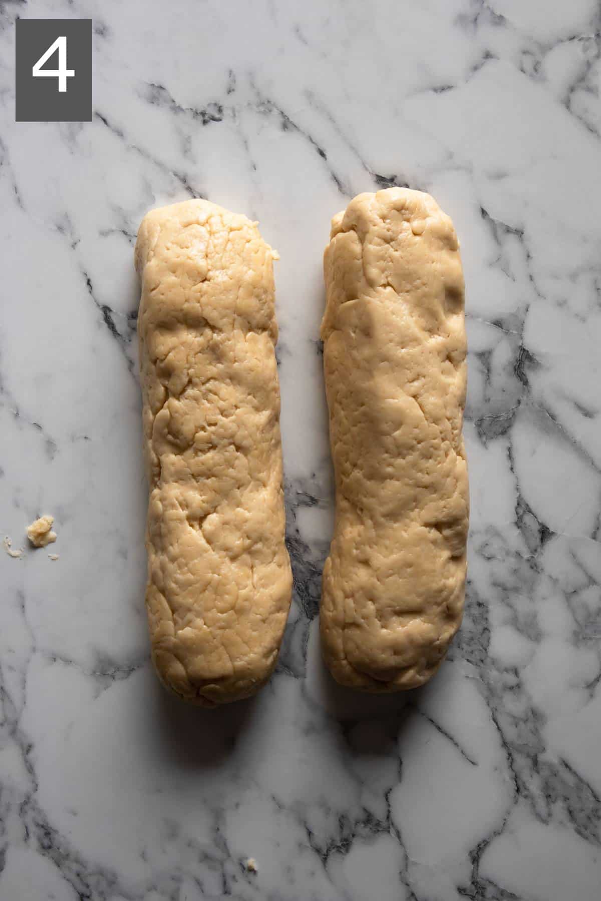 2 portions of the dough shaped into logs.