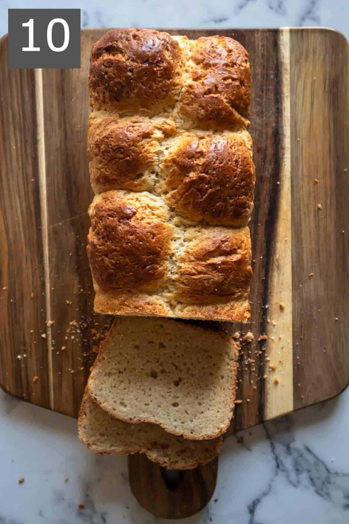 Baked and sliced gluten-free brioche loaf.