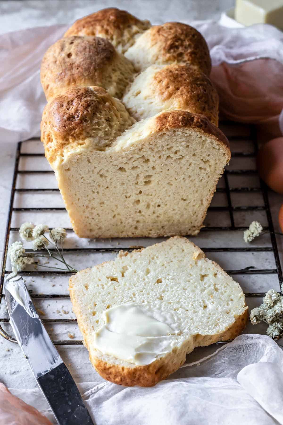 Gluten-free brioche bread slice with butter.