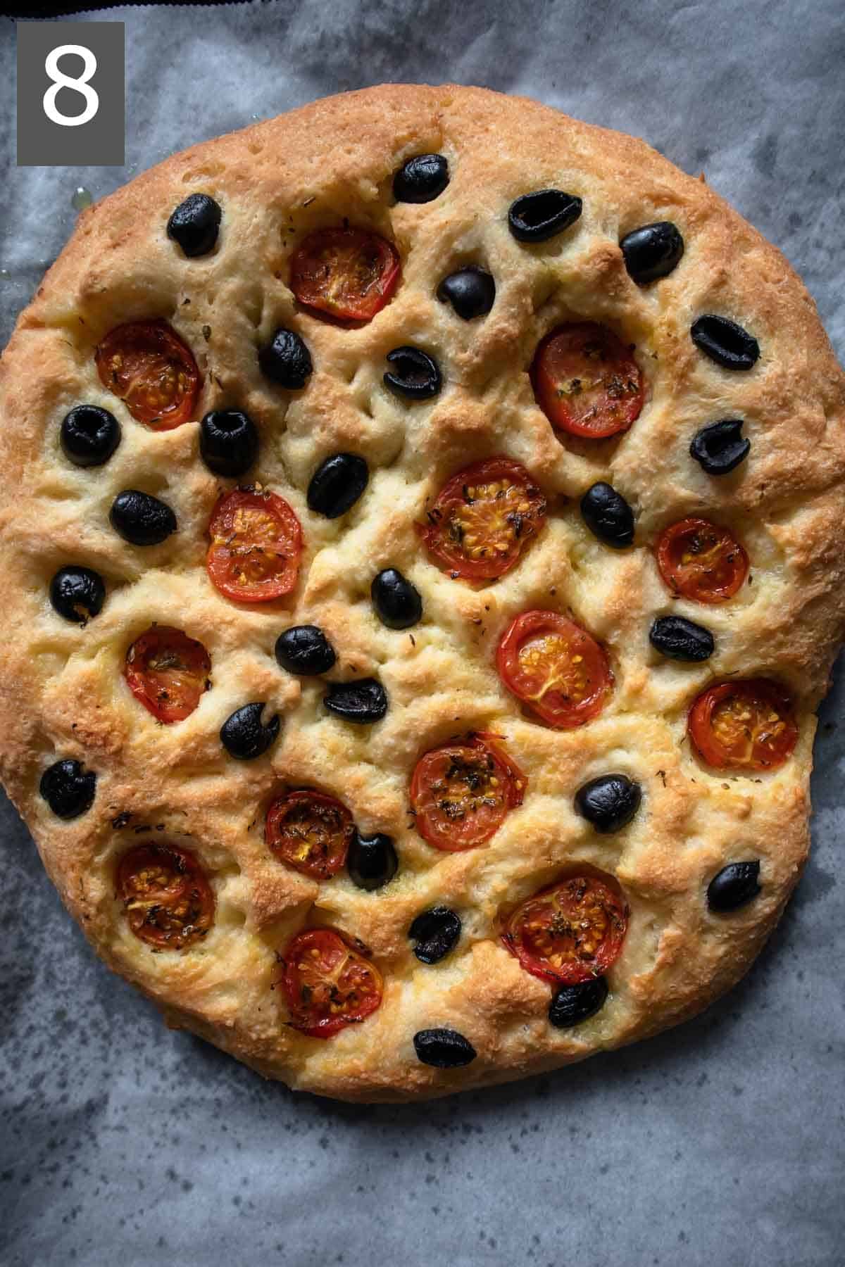 Baked gluten-free focaccia with cherry tomatoes and olives