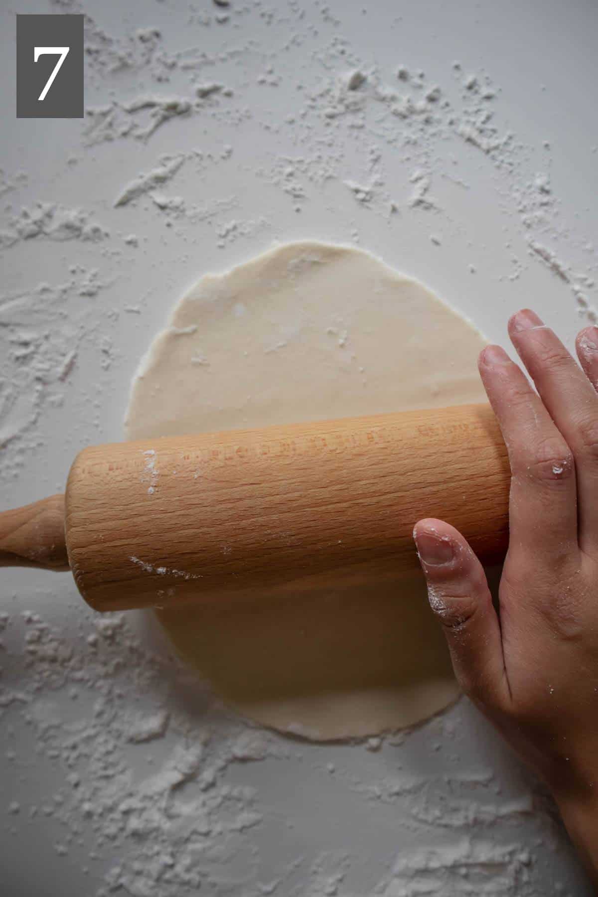 Rolling out gluten-free naan dough.