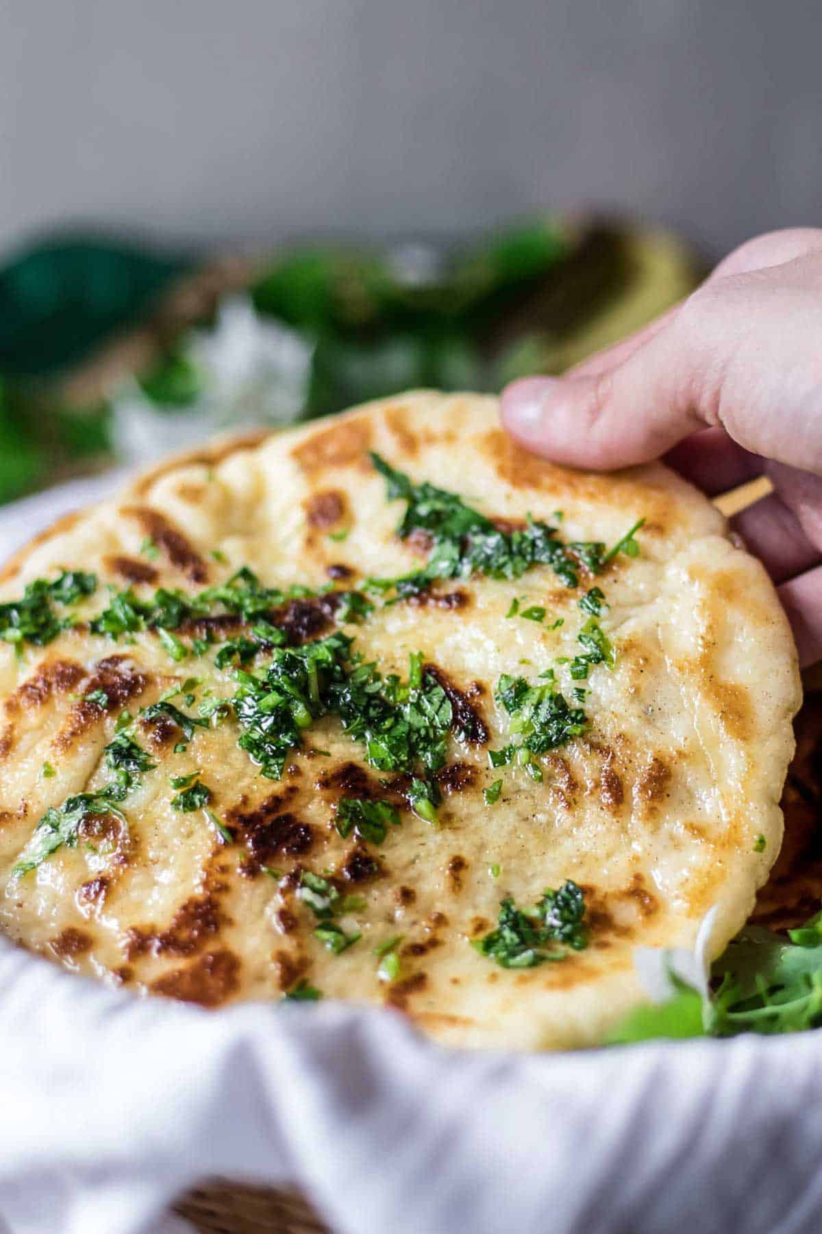 Taking one naan bread.