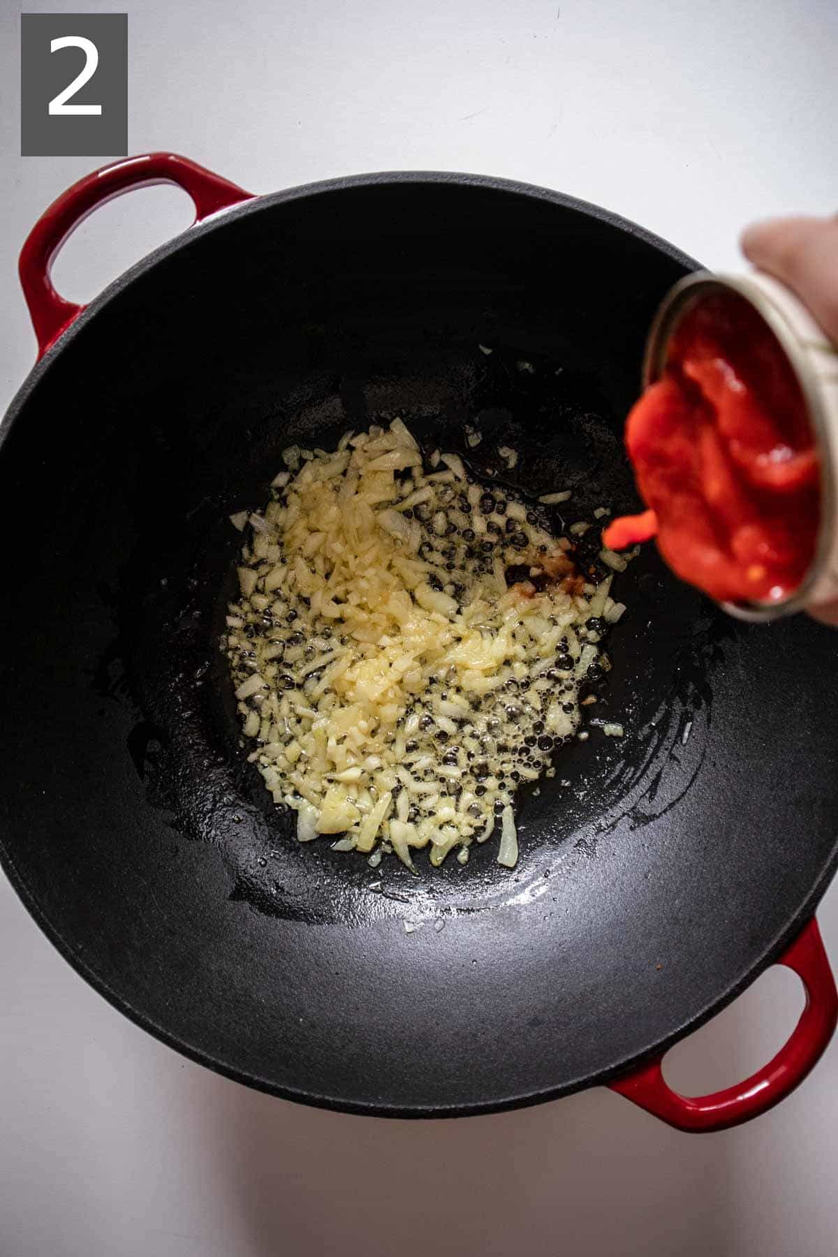 Adding plum tomatoes into a Dutch oven