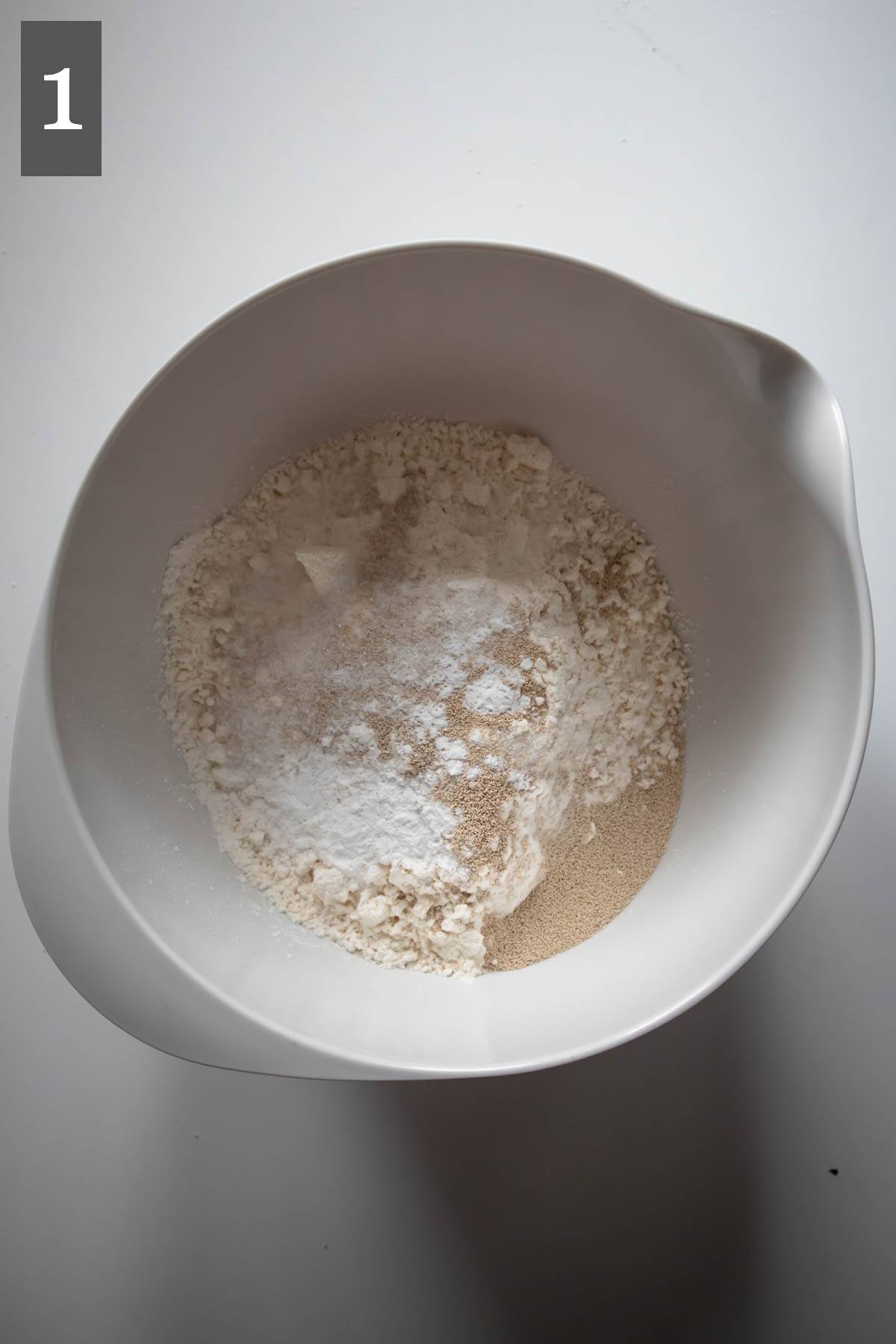 Flour, sugar, salt, baking powder and yeast in a bowl