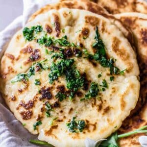 gluten free naan bread topped with fresh parsley