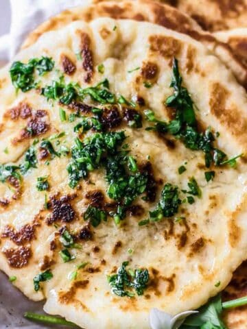 gluten free naan bread topped with fresh parsley