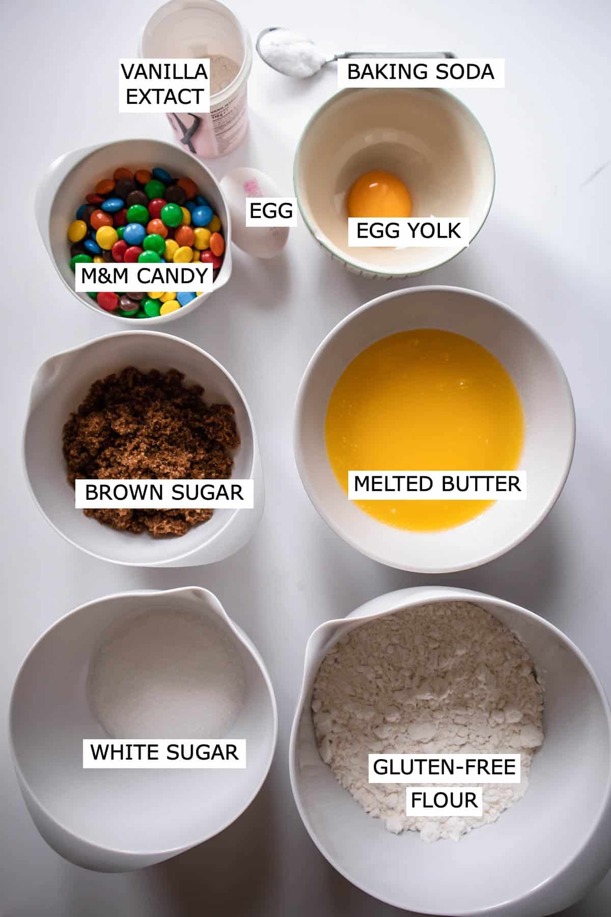 Ingredients: Vanilla extract, baking soda, M&M candy, egg, egg yolk, brown sugar, melted butter, white sugar, gluten-free flour.