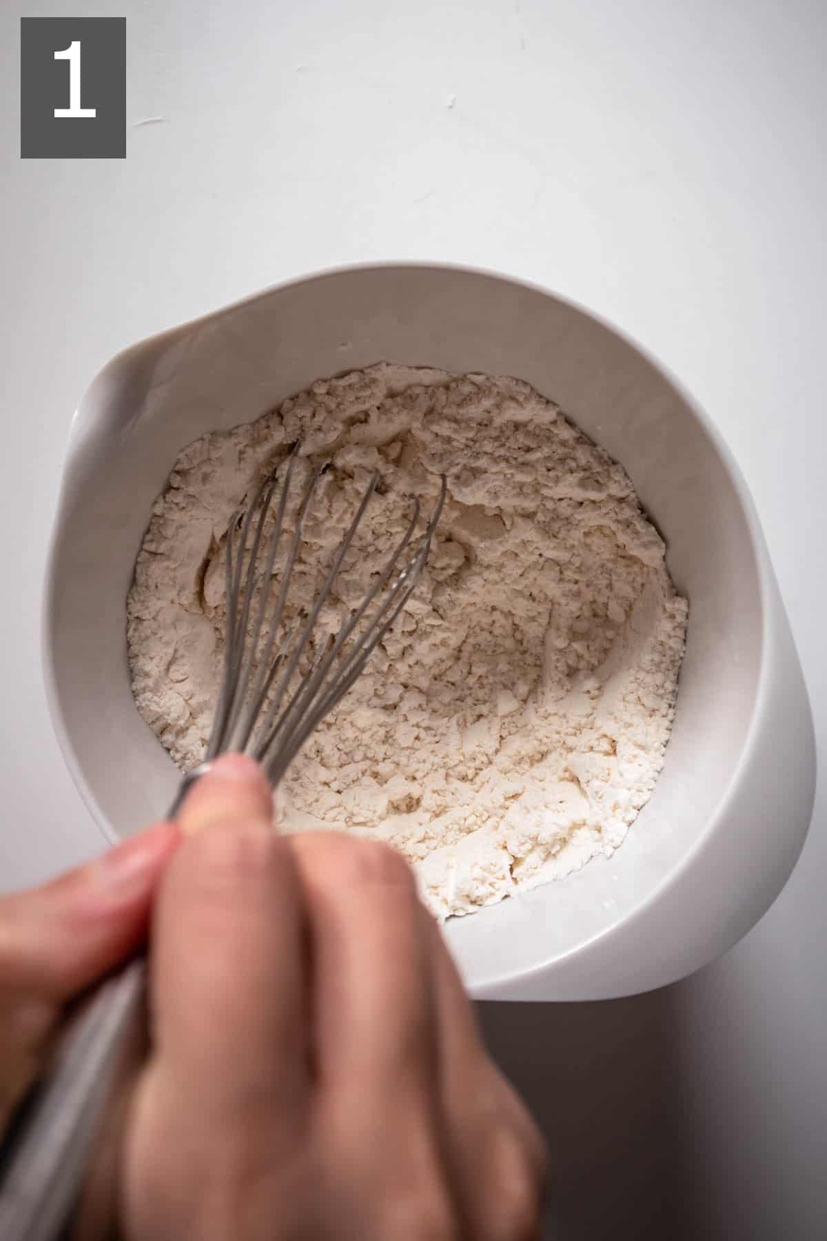 mixing gluten-free flour with baking soda and salt.