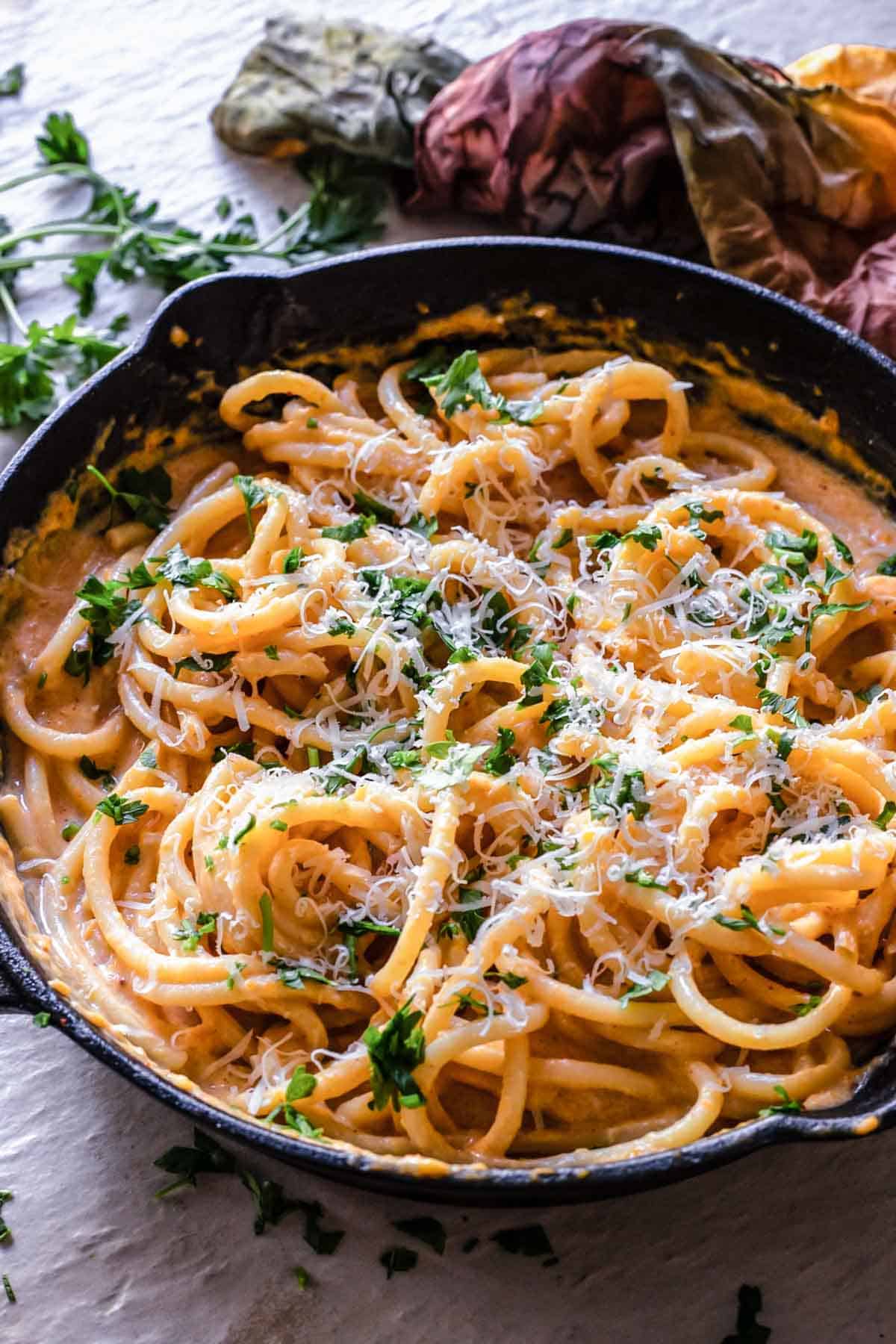 Pumpkin pasta sauce over spaghetti.