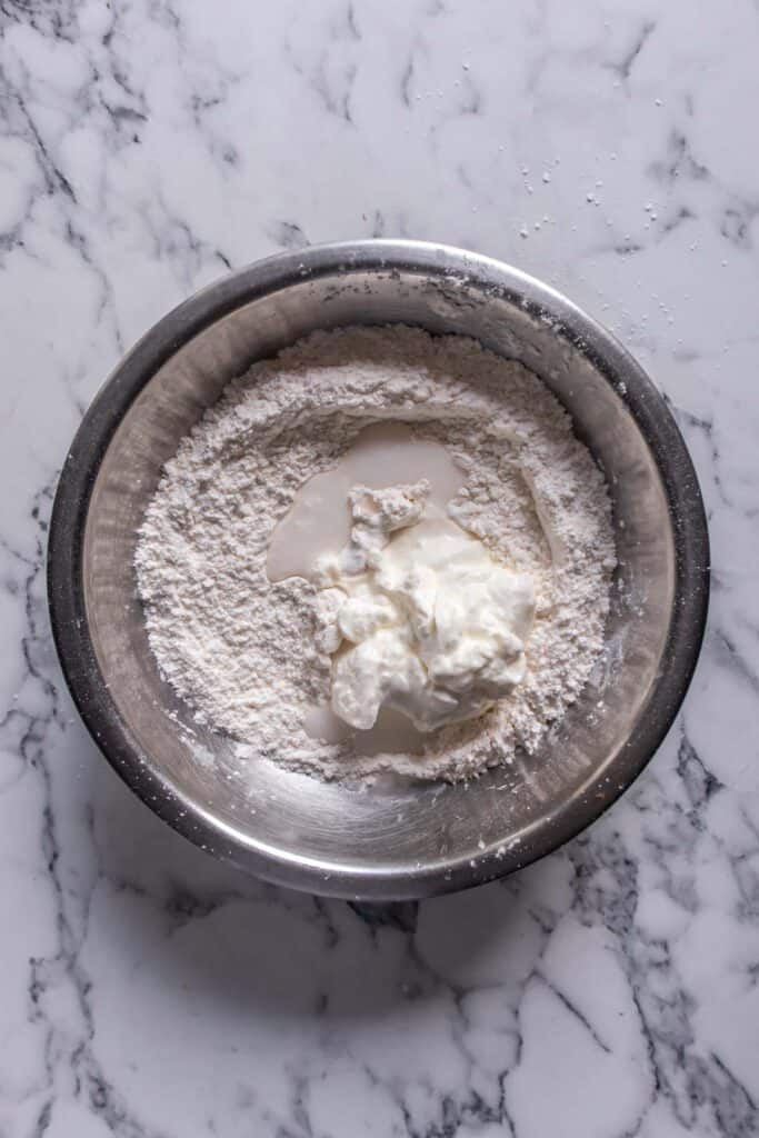 Flour, salt, sour cream and flour in a bowl