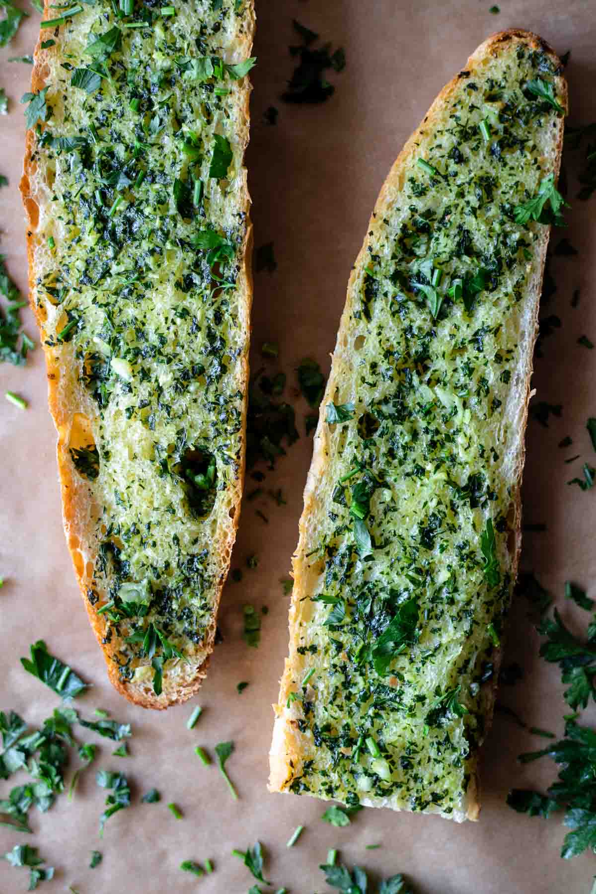 Two slices of gluten-free garlic bread.