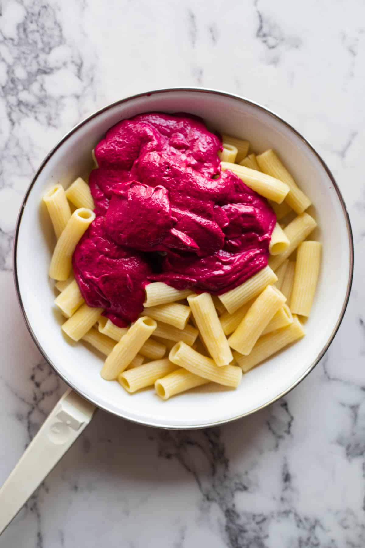 Creamy pink sauce over pasta.