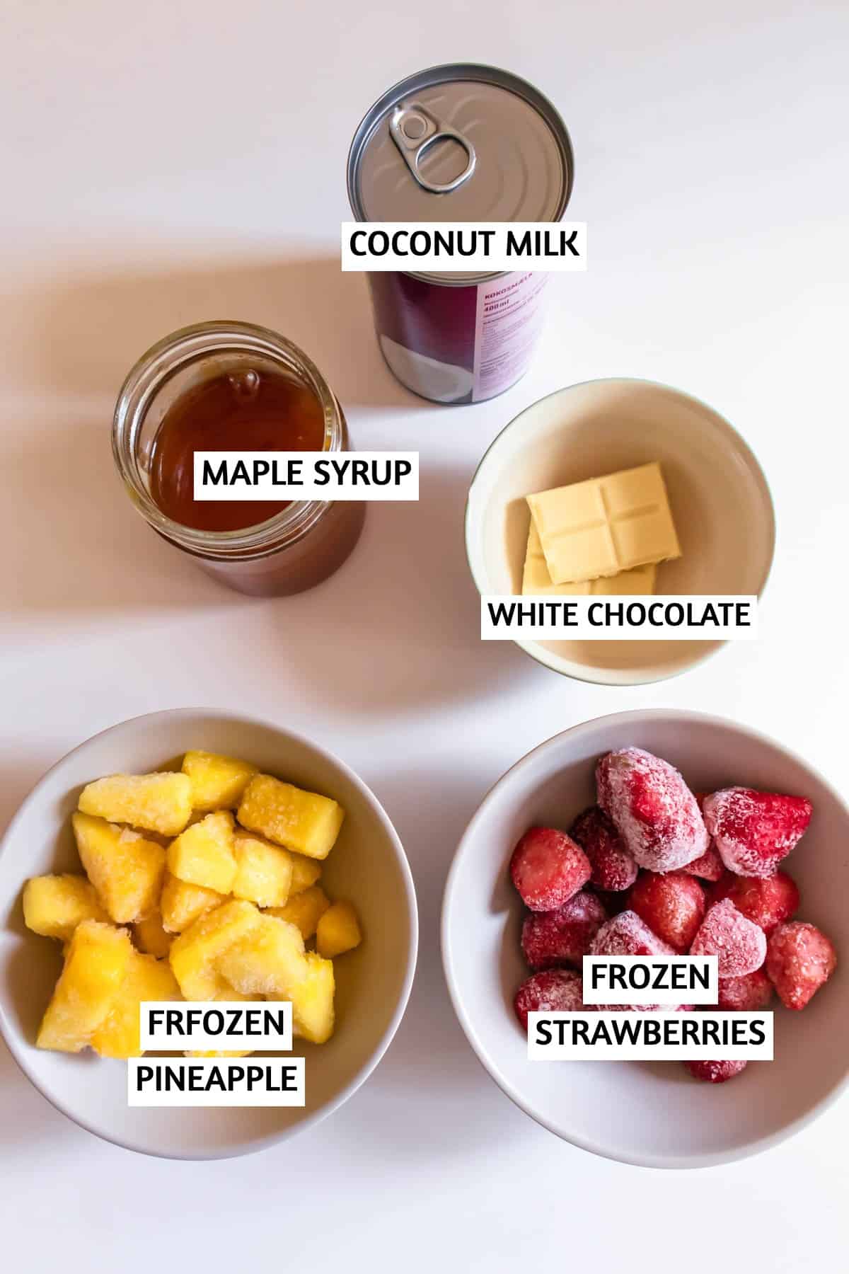 Coconut milk, maple syrup, white chocolate, frozen pineapple, frozen strawberries