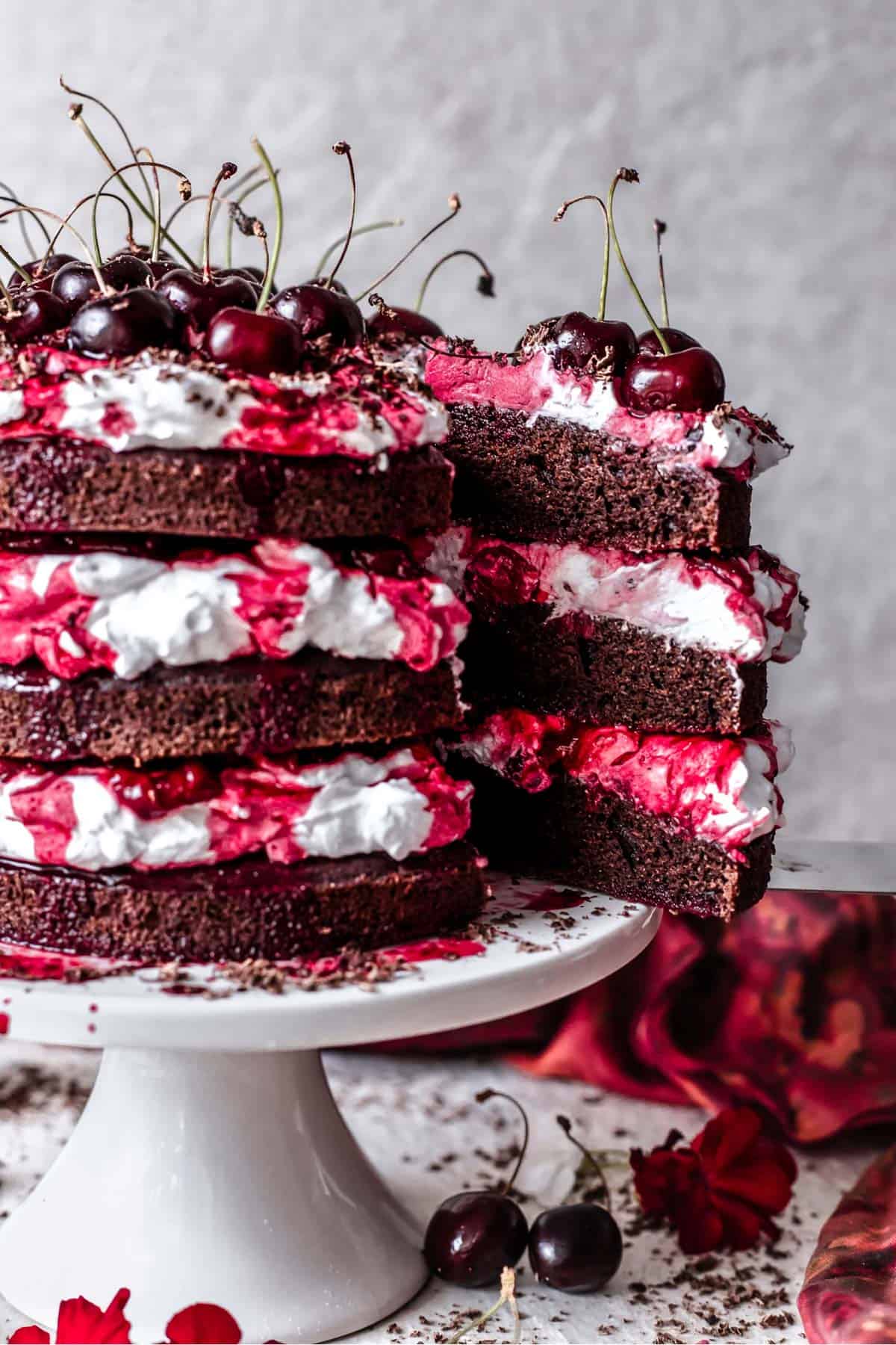 A close up of a sliced black forest cake