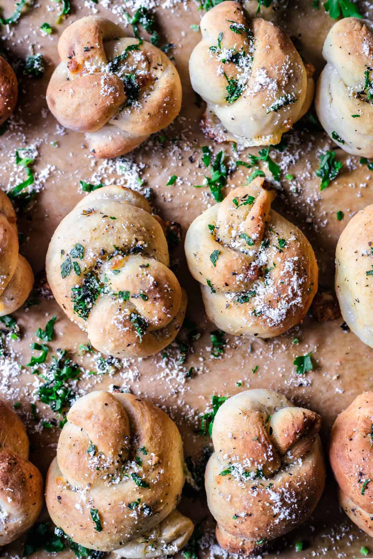 Gluten-free garlic knots on a parchment paper