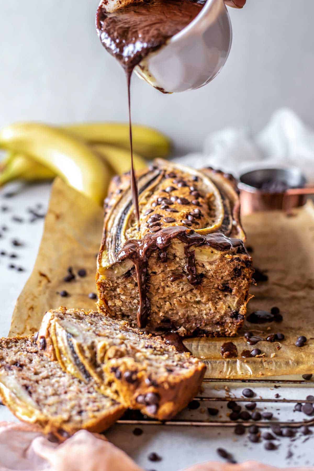 Melted hot chocolate poured over low FODMAP Banana Bread