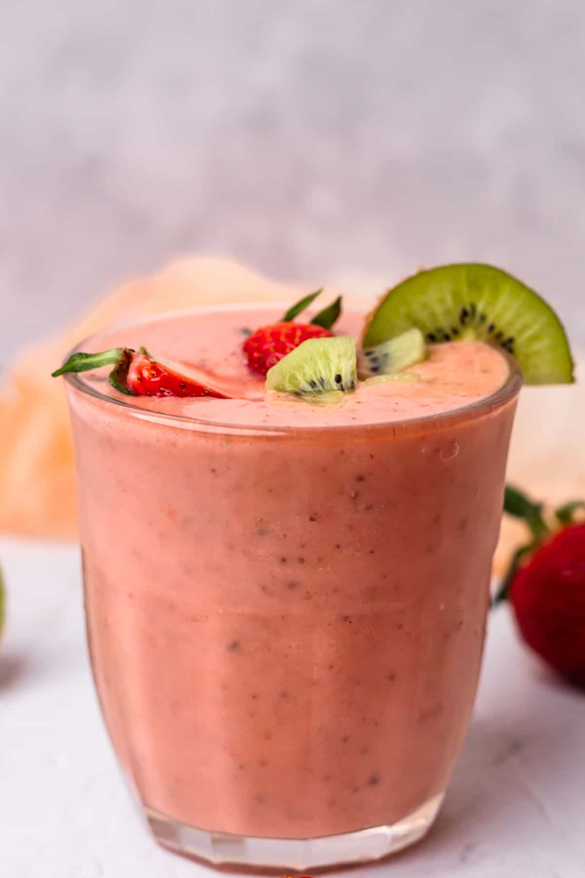 Kiwi and strawberry smoothie in a glass