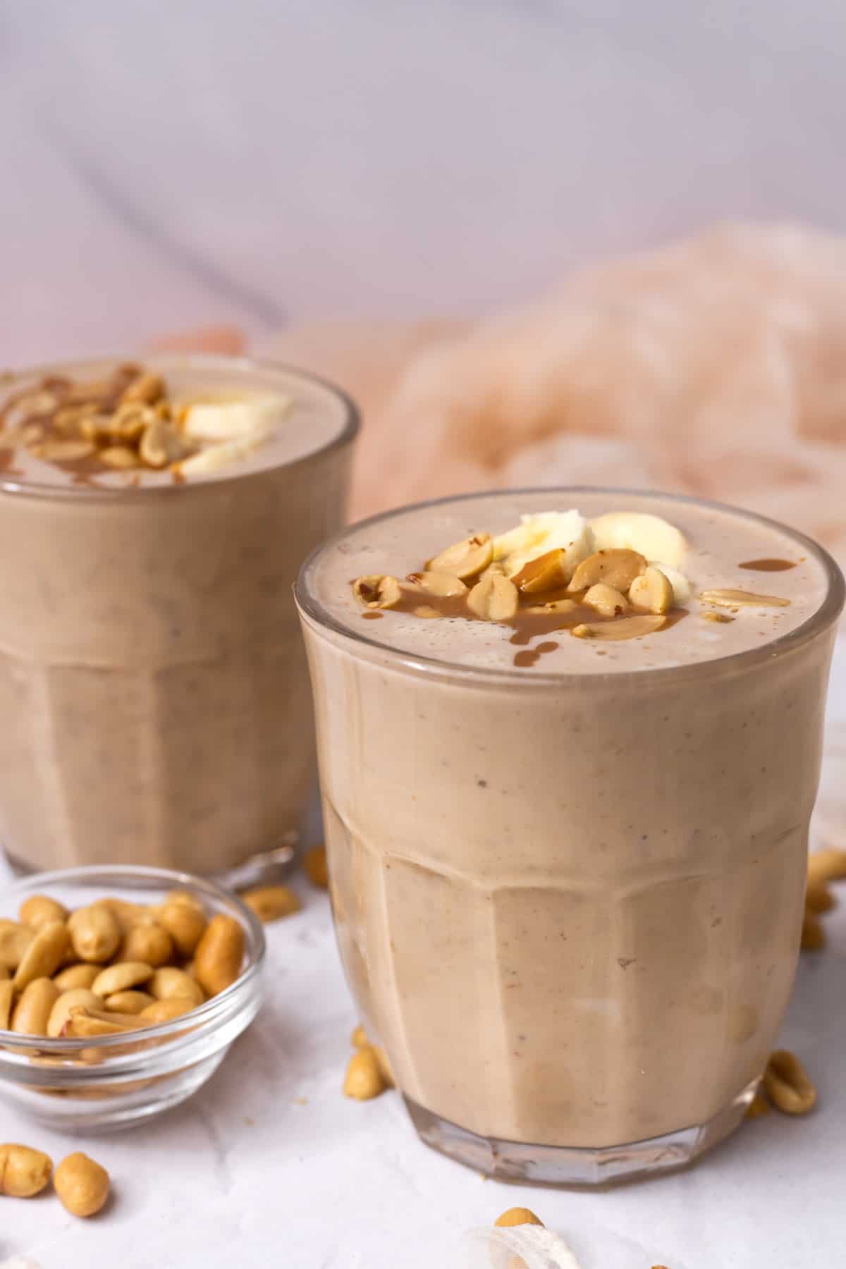 Two glasses with peanut butter smoothie