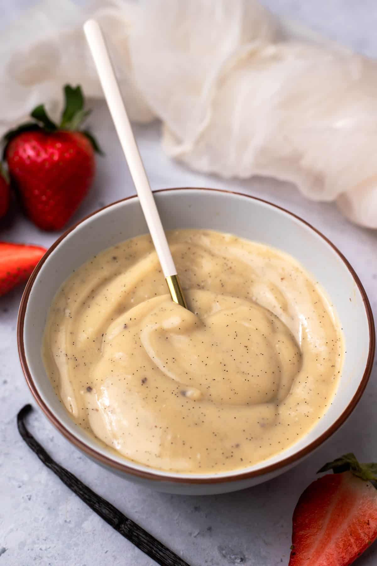 Strawberries and a bowl of custard.