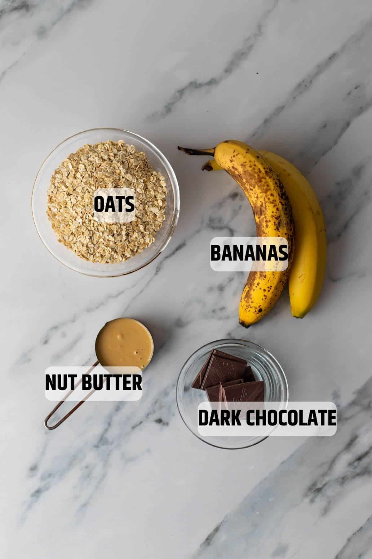 Ingredients for banana oatmeal cookies on a marble surface