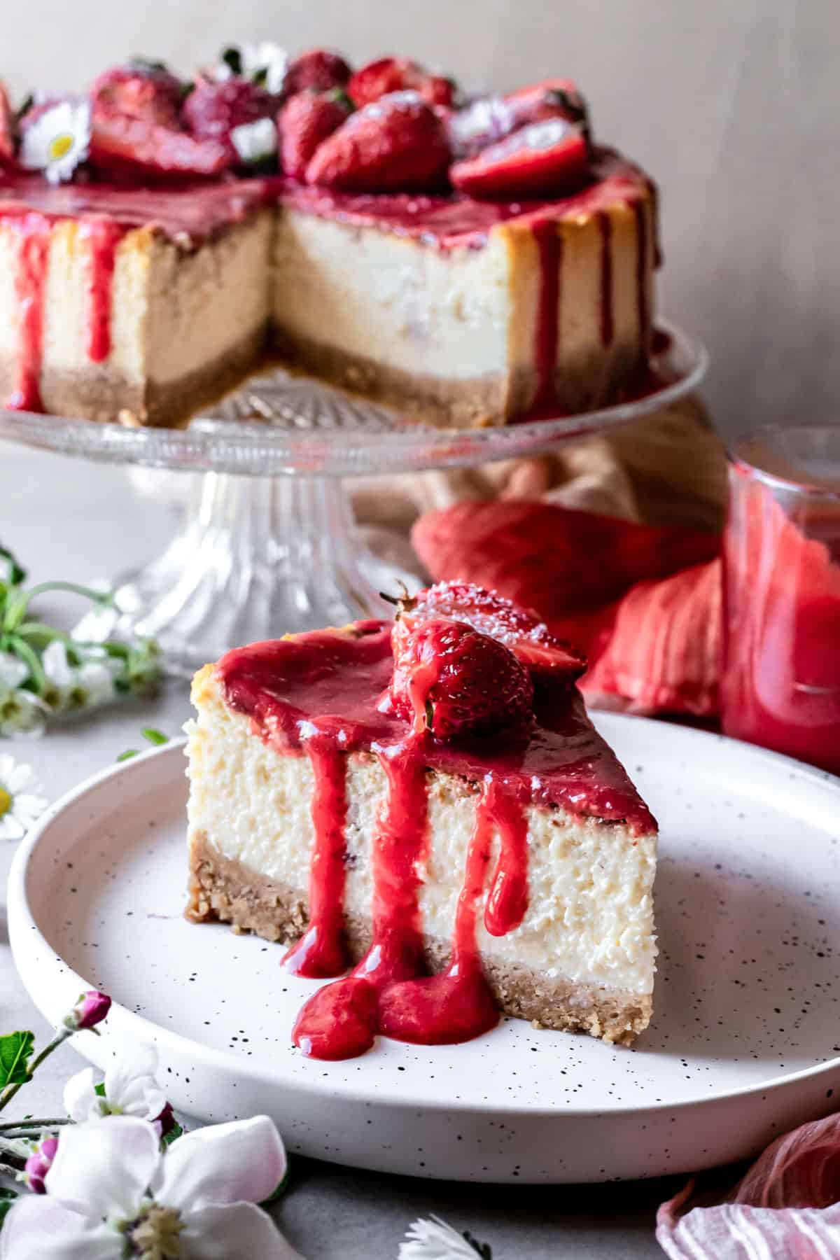 Cheesecake slice with strawberry sauce.