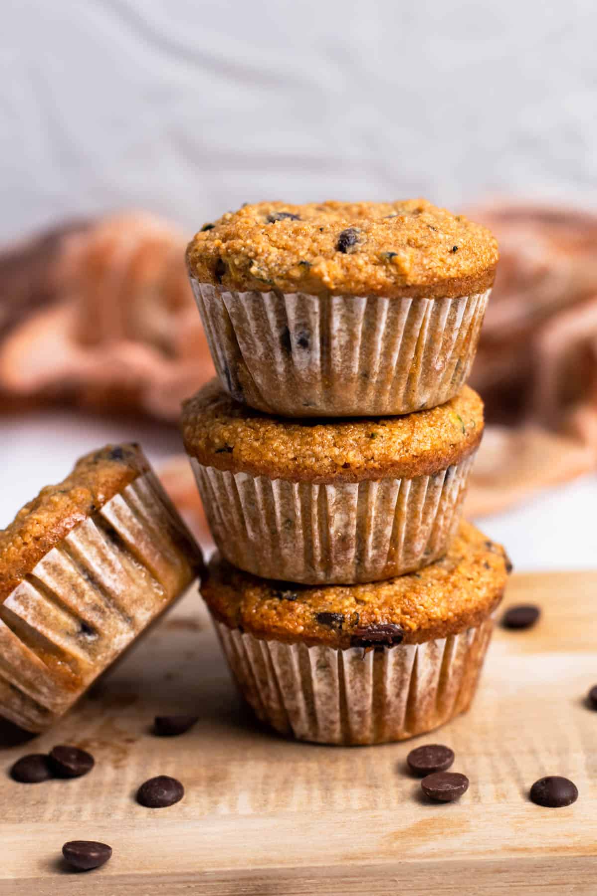Almond Flour Zucchini Muffins stacked on top of each other.