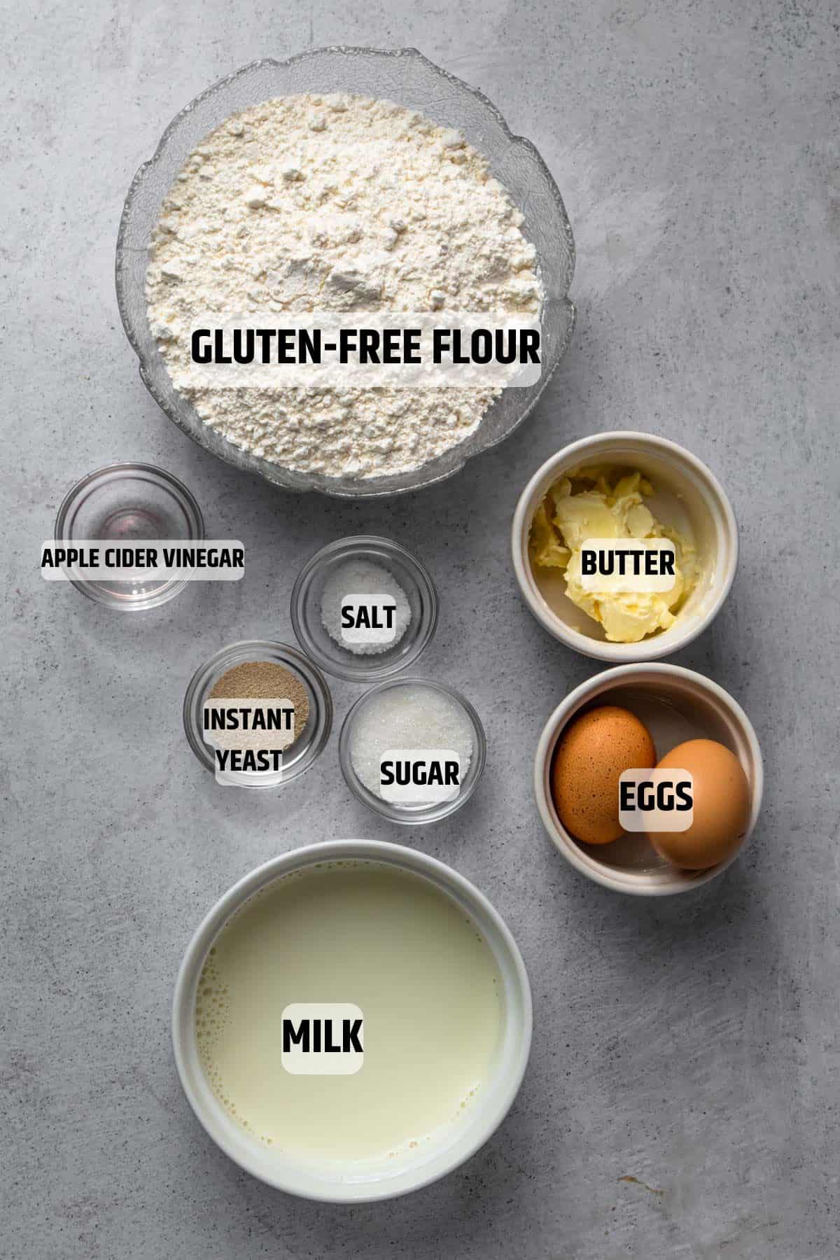 Ingredients for gluten-free dinner rolls on a grey surface