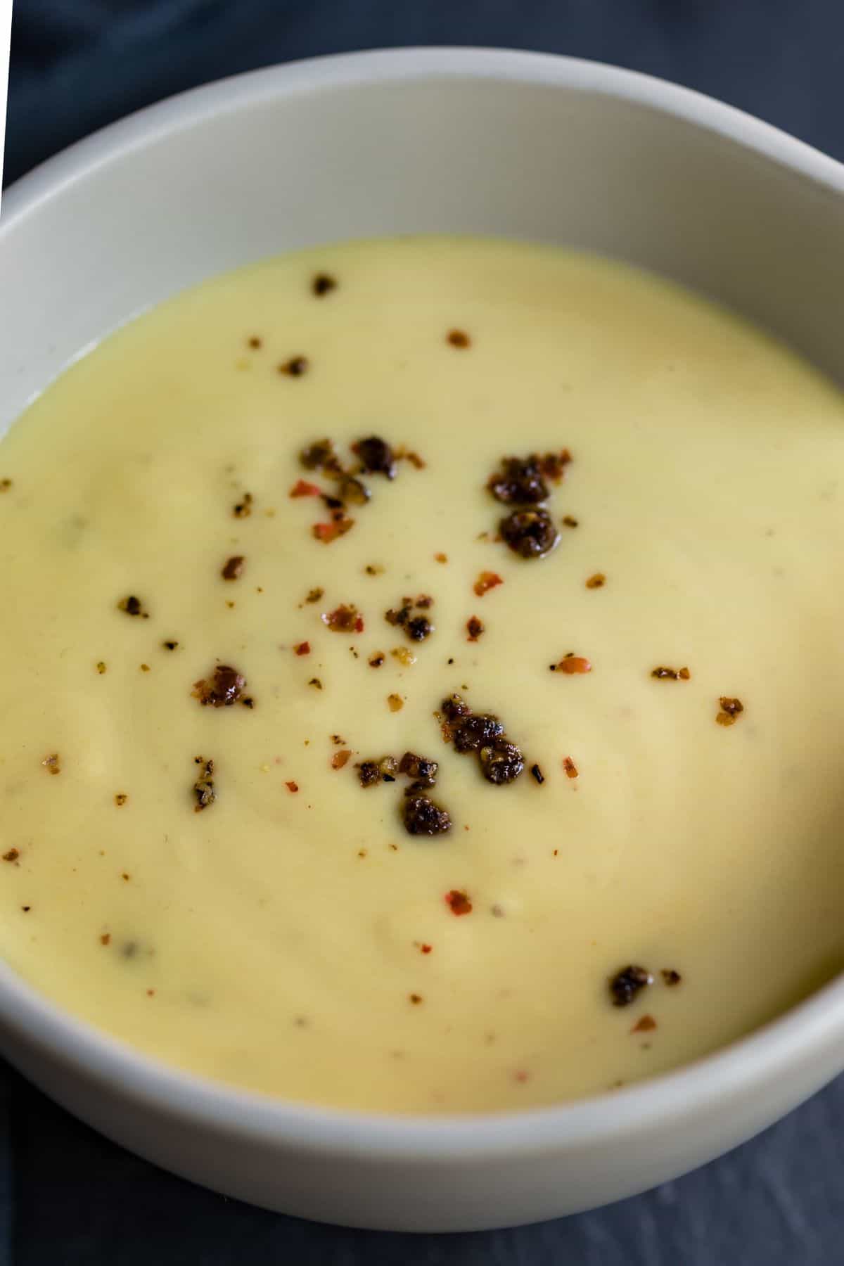 Honey mustard dip in a small white bowl