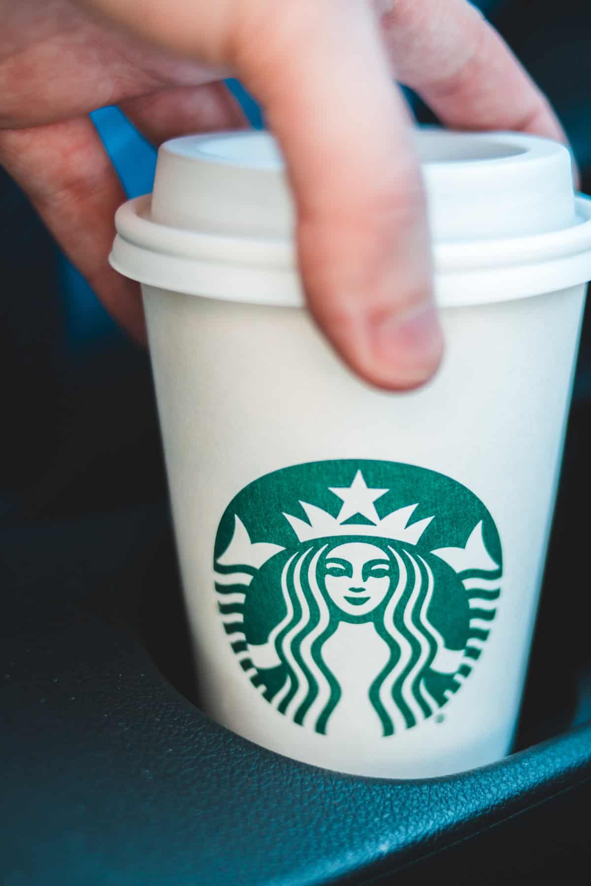 Holding hot coffee from Starbucks