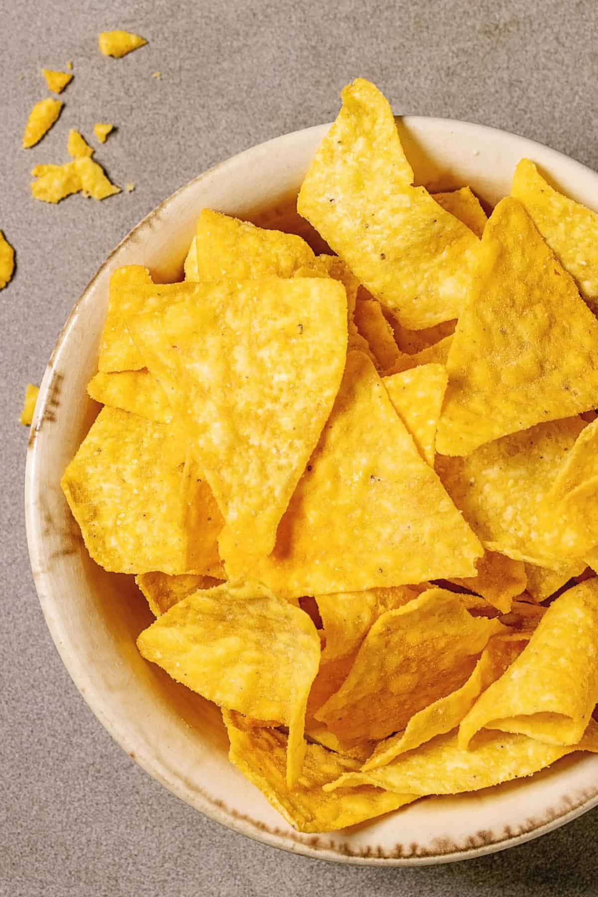 Nacho chips in a white bowl