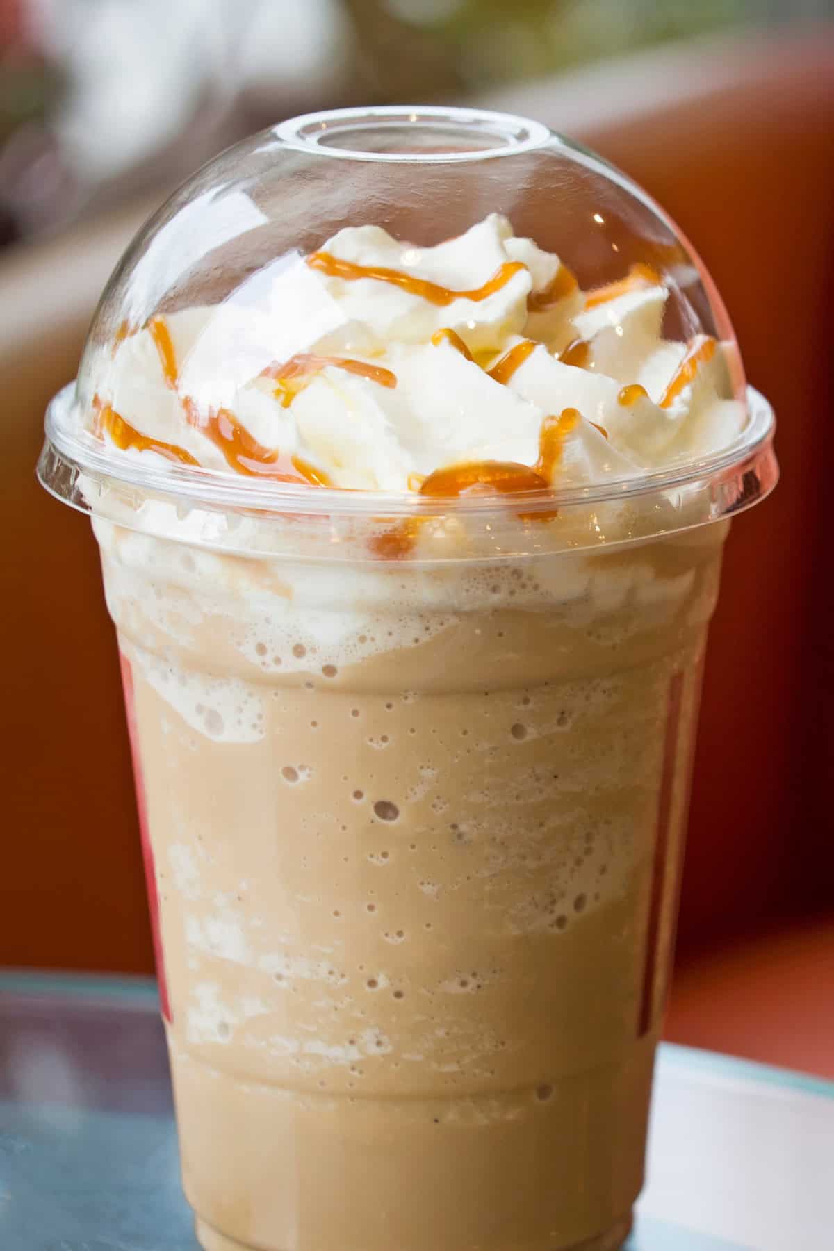 Signature Iced Latte in a plastic cup