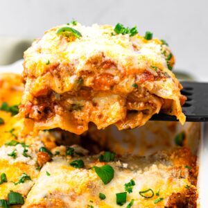 Slice of lasagna photographed from the side.