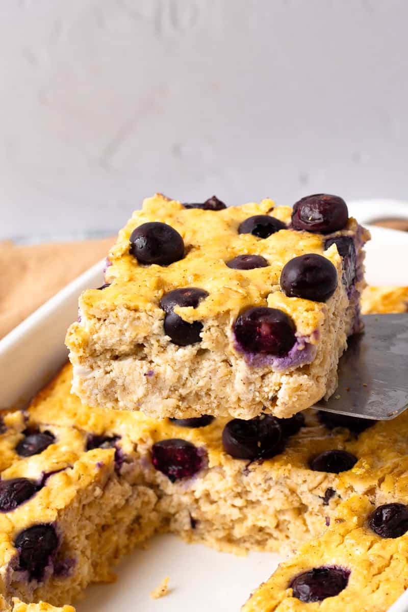 serving a piece of Blueberry cottage cheese breakfast bake from the casserole dish
