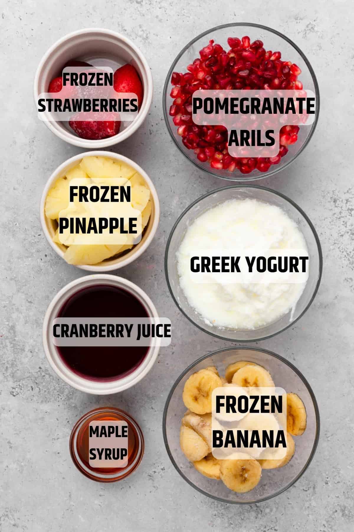 labeled ingredients needed to make a pomegranate tropical smoothie recipe